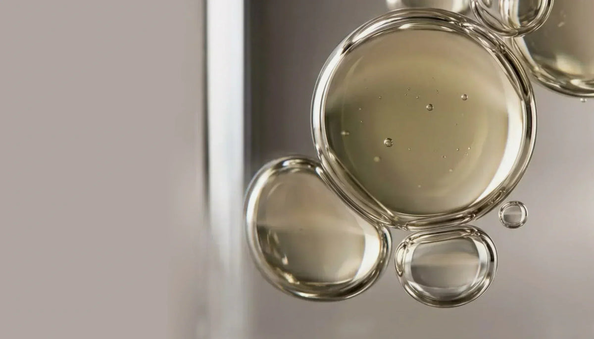 Macro photograph of golden serum bubbles
