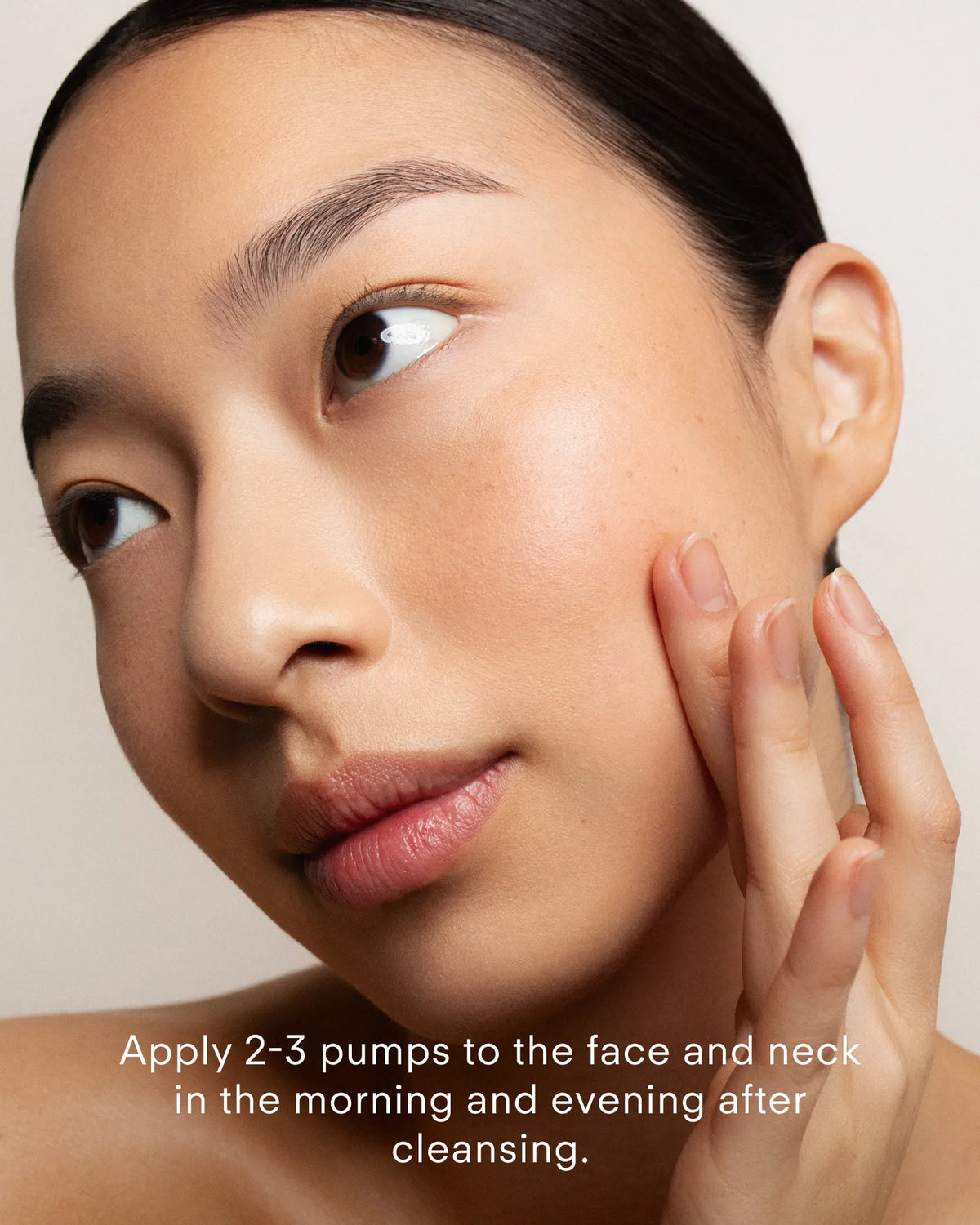 Woman applying Z Clear Shikimic Hydroxy-Biome Facial Serum to cheek after cleansing